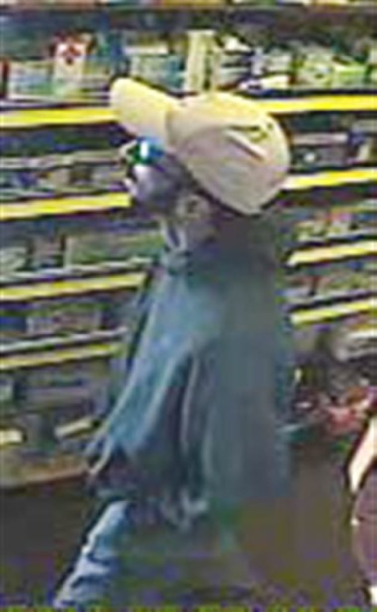 A surveillance photo released by Suffolk County Police, Monday, June 20, 2011 shows a suspect in the killings of four people at Haven Drugs in Medford, N.Y. Investigators believe that a single gunman was responsible for the shooting of two employees and two customers inside the pharmacy, Sunday, June 19, 2011. (AP Photo/Suffolk County Police)